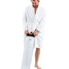 Man in a white dressing gown standing up and wearing a LimbO Full Leg Cast Waterproof Protector on his right leg