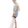 A woman in a blue towel standing up and wearing a full leg LimbO Waterproof Protector on her left leg