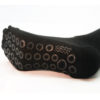 A black anti-slip Prosox Ankle Length Sock that has been placed on a mannequin leg to demonstrate the appearance when worn on an actual leg.