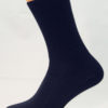 A navy blue cotton Prosox Ankle Length Sock that has been placed on a mannequin leg to demonstrate the appearance when worn on an actual leg.