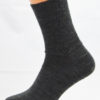 A grey wool Prosox Ankle Length Sock that has been placed on a mannequin leg to demonstrate the appearance when worn on an actual leg.