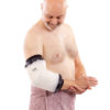 Man in pink towel standing up and wearing a LimbO Waterproof Protector on his right elbow