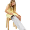 Young girl sitting down in a yellow towel wearing a Child’s Full Leg Cast Waterproof Protector on her right leg
